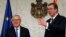 European Commission President Jean-Claude Juncker, left, speaks with Serbia's President Aleksandar Vucic in Belgrade, Serbia, Feb. 26, 2018.