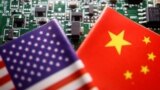 (FILE) Illustration picture of Chinese and U.S. flags with semiconductor chips.