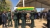 Soldiers carry a coffin with the body of former Zimbabwean president Robert Mugabe before his burial in Zvimba, Zimbabwe, Sept. 28, 2019. (C. Mavhunga/VOA)