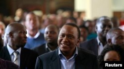 Presiden terpilih Kenya, Uhuru Kenyatta menghadiri misa Paskah di Gereja Katolik Santo Austin di Nairobi (31/3).