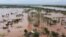 FILE - This video grab taken from handout aerial video footage by UNICEF Jan. 24, 2021, shows widespread flooding in the Buzi area of Mozambique after the landfall of Cyclone Eloise. (AFP PHOTO/UNICEF/Bruno Pedro)