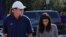 FILE - Kim Kardashian and Bruce Jenner are pictured heading back to their cars after having lunch in West Hollywood, California, Oct. 21, 2014.