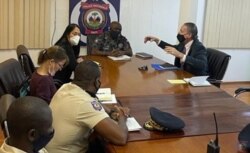 FILE - U.S. Special Envoy Daniel Foote meets with National Police Chief Leon Charles, U.S. Ambassador Michele Sison and a police official in Haiti over the weekend, in this image posted by the national police on Twitter on July 24, 2021.