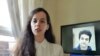 Screen grab of May 5, 2020, Twitter video in which Aida Younesi, Britain-based sister of student Ali Younesi whom Iranian authorities detained on April 10, 2020, criticizes Iran's treatment of her brother, seen on screen behind her.