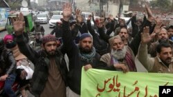 Activists from the Pakistani religious party Sunni Threek protest the Supreme Court's decision to uphold the acquittal of Aasia Bibi, in Lahore, Pakistan, Jan. 30, 2019.