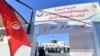 Tunisians arrive to cast their votes in the presidential election at a polling station in Tunis on Oct. 6, 2024. 