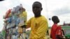 A boy displays his wares for sale along a road near the central market in Nigeria's northern city of Kaduna.