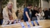 FILE - Apple iPhone 16 smartphones are displayed at a store in London, Oct. 6, 2024. Britain's competition watchdog announced investigations, Jan. 23, 2025, targeting Apple and Google mobile phone ecosystems under new powers to crack down on digital market abuses. 