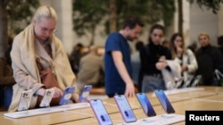 FILE - Apple iPhone 16 smartphones are displayed at a store in London, Oct. 6, 2024. Britain's competition watchdog announced investigations, Jan. 23, 2025, targeting Apple and Google mobile phone ecosystems under new powers to crack down on digital market abuses. 