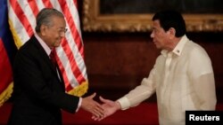 Malaysian Prime Mahathir Mohamad and Philippine President Rodrigo Duterte