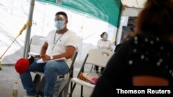  Andy Molina, a migrant from Honduras under the Migrant Protection Protocols (MPP) program, waits at a migrant shelter before being transferred to continue his asylum request in the United States, in Ciudad Juarez, Mexico, June 18, 2021.