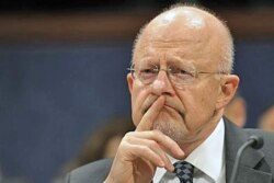 FILE - Then-Director of National Security James Clapper testifies before the House Intelligence Committee on Capitol Hill in Washington, Feb. 2, 2012.