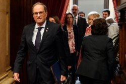 Catalan regional president Quim Torra arrives to address the chamber during a plenary session at the parliament in Barcelona, Oct. 17, 2019.