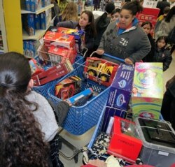 File -- A traffic jam of Black Friday shoppers in the aisles of a toy store in San Rafael, California.