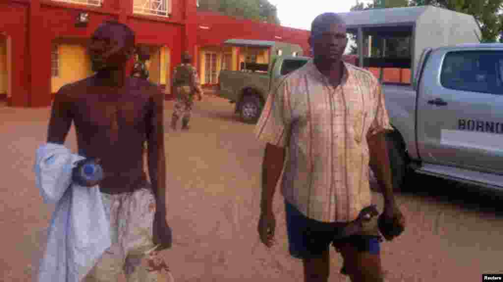 Injured policemen are seen outside Shehu's Palace of Bama, Maiduguri, Borno State, Nigeria. May 7, 2013.