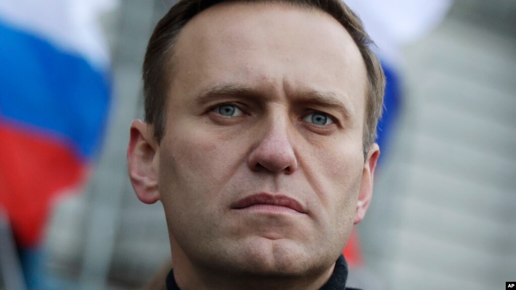 FILE - In this Feb. 29, 2020, file photo, Russian opposition activist Alexei Navalny takes part in a march in memory of opposition leader Boris Nemtsov in Moscow, Russia. Navalny has been poisoned and hospitalized on Thursday morning, Aug. 20, 2020…