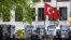 FILE - Marking the World Press Freedom Day, activists with Reporters Without Borders hold posters with portraits of journalists detained in Turkey, to protest against the situation for media in the country, in front of the Turkish embassy in Berlin, May 3, 2017.