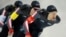 Denny Morrison, left, Jordan Belchos, center, Ted-Jan Blomen, right, of Canada, skate in the men's team pursuit competition at a World Cup speedskating event, Dec. 8, 2017, in Salt Lake City.