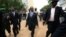 Somalia's new president Hassan Sheikh Mohamud (C) is escorted as he attends his inauguration ceremony in Mogadishu September 16, 2012.