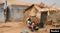 A woman takes care of her child in a camp sheltering internally displaced people in Bangui, Central African Republic. (File)