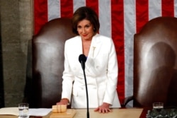 FILE - House Speaker Nancy Pelosi of California waits before then-President Donald Trump arrives to deliver his State of the Union address to a joint session of Congress on Capitol Hill in Washington, Feb. 4, 2020.