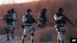 Mexican National Guard members patrol along the Mexico-US border in Ciudad Juarez, Feb. 5, 2025. 