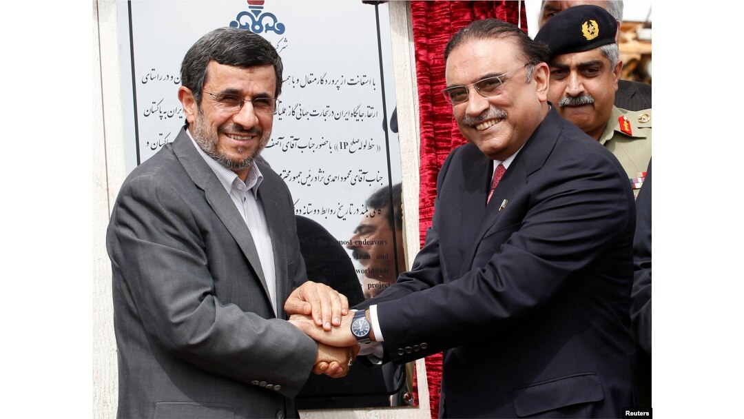 FILE - Iran's President Mahmoud Ahmadinejad (left) shakes hands with his Pakistani counterpart Asif Ali Zardari, during a groundbreaking ceremony to mark the start of construction of the Iran-Pakistan gas pipeline, in Chahbahar, Iran, March 11, 2013.