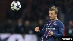 Paris St Germain's David Beckham reacts during their Champions League quarter-final first leg soccer match against Barcelona at the Parc des Princes Stadium in Paris, France, April 2, 2013. 