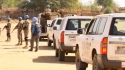 Members of the United Nations and African Union peacekeeping mission (UNAMID) gather with their vehicles in Kalma camp for internally displaced people in Nyala, the capital of South Darfur, Dec. 31, 2020.