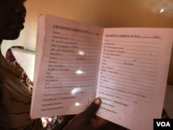 Irakoze, 22, shows empty pages of her household log book. She is yet to receive a visitor since the book register was introduced in 2016. Burundi authorities argue such a book will keep the peace and security. (M. Yusuf for VOA)