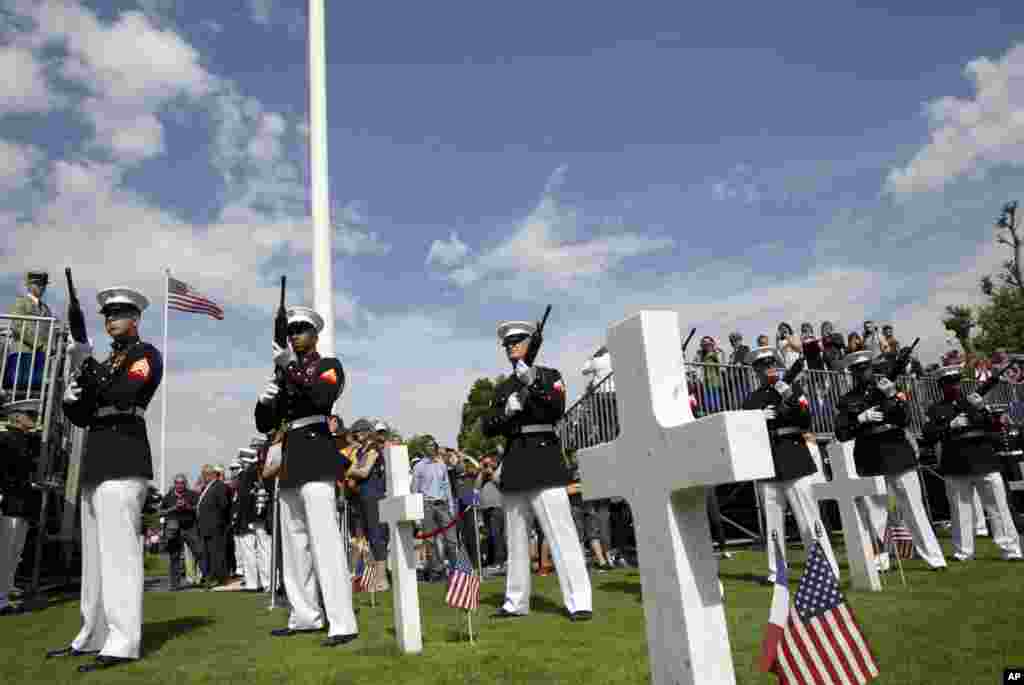 A U.S. Marine Corps detail fires a volley during a Memorial Day commemoration at the Aisne-Marne American Cemetery in Belleau, France, May 27, 2018.