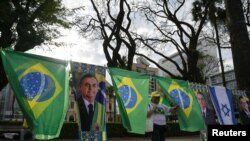 A supporter of Brazil's president and re-election candidate Jair Bolsonaro arrives at a campaign event in Belo Horizonte, Brazil, on August 24, 2022.