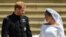 Britain's Prince Harry, Duke of Sussex and his wife Meghan, Duchess of Sussex, leave from the West Door of St George's Chapel, Windsor Castle, in Windsor, on May 19, 2018, after their wedding ceremony. 