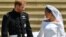 FILE - Britain's Prince Harry, Duke of Sussex and his wife Meghan, Duchess of Sussex leave from the West Door of St George's Chapel, Windsor Castle, in Windsor, on May 19, 2018 after their wedding ceremony. 