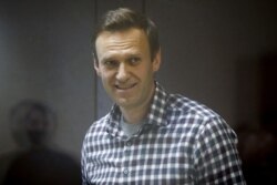 FILE - Russian opposition politician Alexey Navalny attends a court hearing in Moscow, Russia, Feb. 20, 2021.