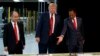 FILE - President Donald Trump takes a tour of Foxconn with Foxconn chairman Terry Gou, right, and CEO of SoftBank, Masayoshi Son, June 28, 2018, in Mt. Pleasant, Wisconsin.