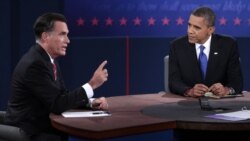 U.S. Republican presidential nominee Mitt Romney makes a point as U.S. President Barack Obama listens during the final U.S. presidential debate in Boca Raton, Florida, October 22, 2012.