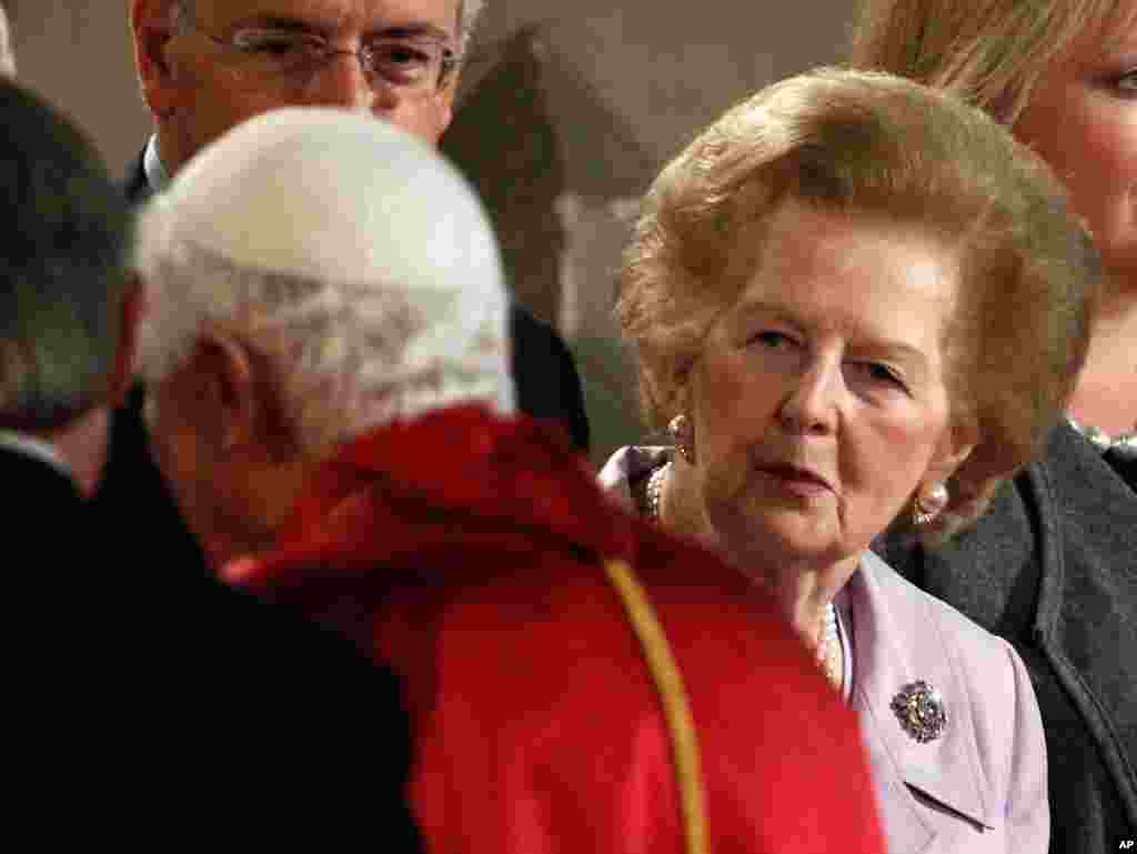 Former British Prime Minster Margaret Thatcher waits to greet then Pope Benedict at Westminster Hall in London, Sept. 17, 2010.