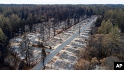 FILE - Homes leveled by the Camp Fire line the Ridgewood Mobile Home Park retirement community in Paradise, Calif., Dec. 3, 2018.