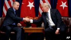 U.S. President Donald Trump shakes hands with Turkish President Recep Tayyip Erdogan during a meeting at the Palace Hotel during the United Nations General Assembly in New York, Sept. 21, 2017.