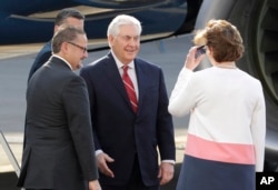 U.S. Secretary of State Rex Tillerson, center, is welcomed by U.S. Ambassador to Mexico Roberta Jacobson, right, and Mauricio Ibarra Ponce de Leon, North America director with Mexico's Foreign Ministry, as he arrives at the airport in Mexico City, Feb. 22, 2017.
