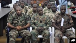 FILE - Soldiers accused of refusing to fight in the country's northeastern Islamic uprising appear before a court-martial in Abuja, Nigeria, Oct. 15, 2014.
