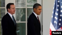 US President Barack Obama (R) and British Prime Minister David Cameron are seen at the White House in Washington in this March 14, 2012, file photo.