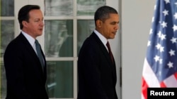 US President Barack Obama (R) and British Prime Minister David Cameron are seen at the White House in Washington in this March 14, 2012, file photo.