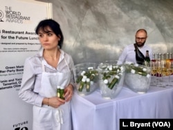 "Green moringa after-party booster juice," made from the drought-resistance moringa plant, is offered to diners at a "Future 50 Foods" tasting at the Pompidou Center in Paris.