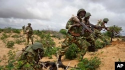 FILE - African Union peacekeepers are seen in the Deynile district of the capital Mogadishu, Somalia. Oct. 20, 2011. Local Somali officials have called on the African Union mission to launch an investigation into two deadly incidents over weekend allegedly involving peacekeepers.