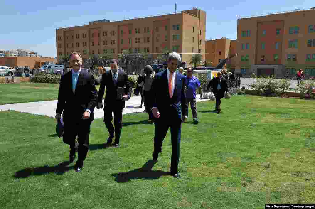 Secretary Kerry, Ambassador Beechcroft, Deputy Assistant Secretary McGurk Walk Across Embassy Baghdad.