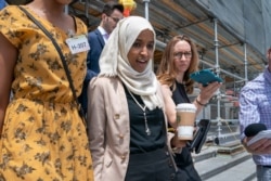 Rep. Ilhan Omar, D-Minn., a target of racist rhetoric from President Donald Trump, walks from the House to her office following votes, at the Capitol in Washington, July 18, 2019.