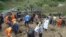 Rescuers search for victims after a landslide engulfed a building of a primary school at Zhenhe village of Yiliang county, Yunnan province, China, October 4, 2012. 