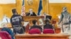 FILE - Donald Trump, far left, watches as the jury foreperson delivers guilty verdicts, with Justice Juan Merchan listening from the bench, in Manhattan Criminal Court on May 30, 2024, in New York. Merchan on Nov. 22, 2024, allowed Trump to seek dismissal of the case.